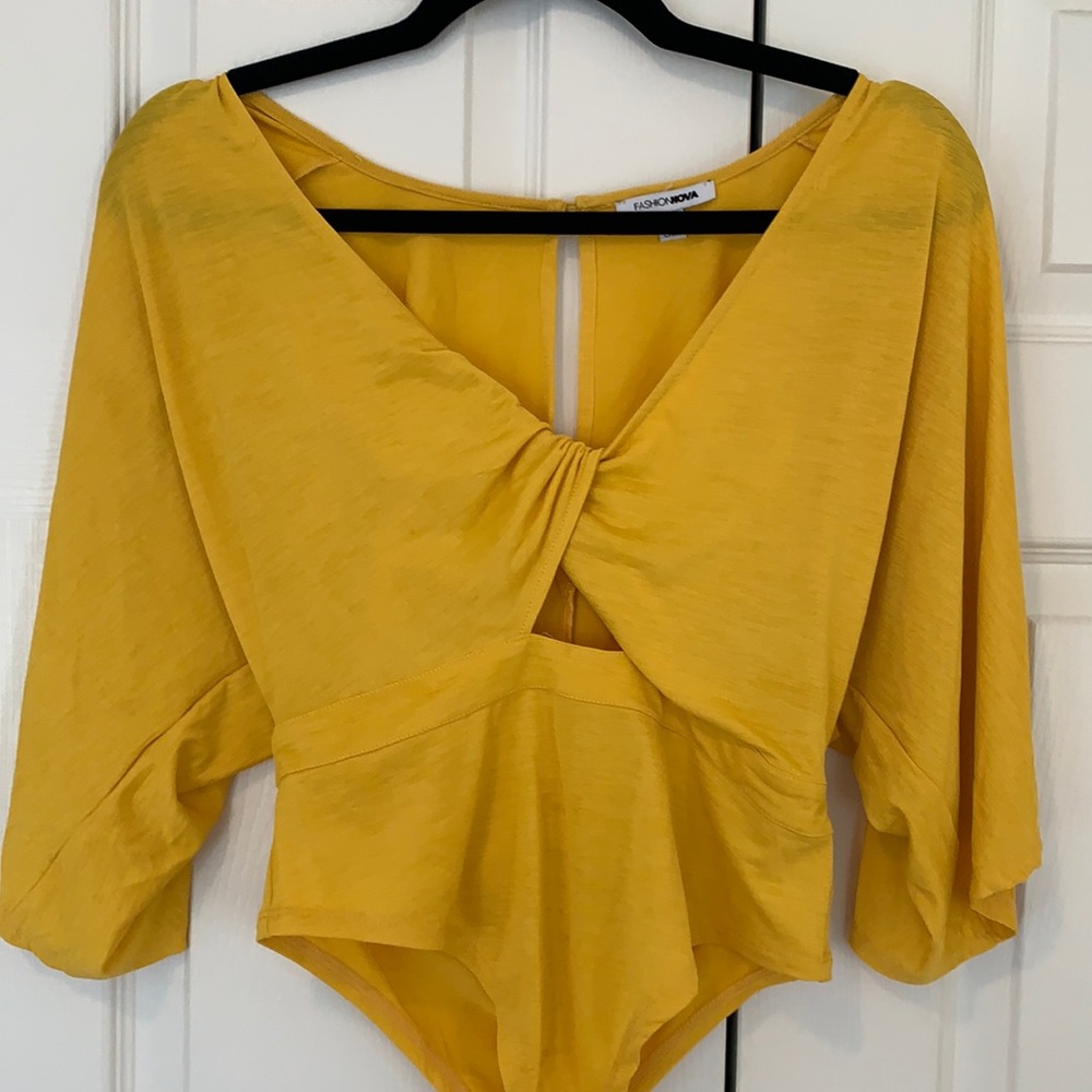 Yellow flowy body suit